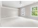 Bright bedroom with two windows, crown molding, and plush carpeting at 30150 Walser, Chapel Hill, NC 27517