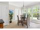 Bright breakfast nook with a table and chairs is surrounded by windows, offering natural light and a pleasant view at 30150 Walser, Chapel Hill, NC 27517