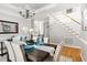 Refined dining room with a beautifully set table, featuring turquoise accents and a view into the living area at 30150 Walser, Chapel Hill, NC 27517