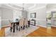 Elegant dining room with stylish chandelier, tray ceilings, and a dark wood table set for a formal meal at 30150 Walser, Chapel Hill, NC 27517