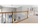Bright and airy landing overlooking the living area, with elegant railings and neutral decor at 30150 Walser, Chapel Hill, NC 27517