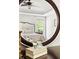 Bedroom with plush bed, nightstand, and view from a large window, captured in the mirror's reflection at 30150 Walser, Chapel Hill, NC 27517