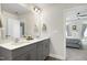 Stylish bathroom features a double vanity, a large mirror, and modern finishes at 3017 Ginger Hill Ln, Durham, NC 27703