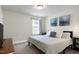 Cozy bedroom featuring a comfortable bed, a window, and stylish wall art at 3017 Ginger Hill Ln, Durham, NC 27703