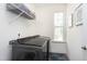 This cozy laundry room is equipped with new washer/dryer and ample shelving at 3017 Ginger Hill Ln, Durham, NC 27703
