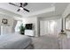 Spacious main bedroom features a ceiling fan and a large window for plenty of natural light at 3017 Ginger Hill Ln, Durham, NC 27703