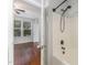 Bathroom featuring a tub, a ceiling fan, and an adjoining bedroom at 302 Red Elm Dr, Durham, NC 27713