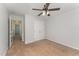 Neutral bedroom featuring a ceiling fan, closet, and easy access to the hallway at 302 Red Elm Dr, Durham, NC 27713