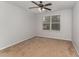 Cozy bedroom with a ceiling fan and natural light from the window at 302 Red Elm Dr, Durham, NC 27713