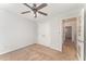 Neutral bedroom featuring a ceiling fan, closet, and easy access to the hallway at 302 Red Elm Dr, Durham, NC 27713