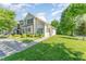 Well-manicured exterior view of home with lush landscaping and inviting entrance at 302 Red Elm Dr, Durham, NC 27713