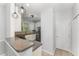 Modern kitchen featuring an island bar, stainless steel appliances, and sleek white cabinetry at 302 Red Elm Dr, Durham, NC 27713