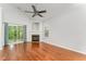 Spacious living room featuring hardwood floors, a fireplace, and a sliding glass door to the outdoors at 302 Red Elm Dr, Durham, NC 27713