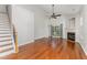 Open-concept living room with hardwood floors, a fireplace, and sliding doors provides an inviting space at 302 Red Elm Dr, Durham, NC 27713