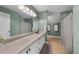 Spa-like bathroom features a long vanity with plenty of storage and shower with modern fixtures at 3035 Tavistock Dr, Durham, NC 27712