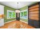 Dining area with hardwood floors, built in shelving units, a ceiling fan, and natural light at 3035 Tavistock Dr, Durham, NC 27712