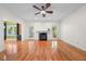 Spacious living room with hardwood floors, fireplace, and ample natural light at 3035 Tavistock Dr, Durham, NC 27712
