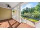 View of the covered porch with brick flooring and white railing at 3035 Tavistock Dr, Durham, NC 27712