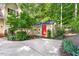 Backyard shed with red door and windows located next to a concrete pad at 3035 Tavistock Dr, Durham, NC 27712