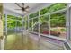 Sun room with many windows bringing in natural light with a patio view at 3035 Tavistock Dr, Durham, NC 27712