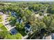 An aerial view of a charming neighborhood with lush greenery and well-maintained homes nestled among mature trees at 3204 Terrel Mill Rd, Raleigh, NC 27616