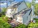 Charming back exterior featuring a wooden deck area perfect for outdoor dining and relaxation at 3204 Terrel Mill Rd, Raleigh, NC 27616