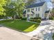 Charming two-story home with manicured lawn, beautiful landscaping, and a spacious driveway at 3204 Terrel Mill Rd, Raleigh, NC 27616