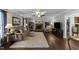 Inviting living room featuring hardwood floors, brick fireplace, and comfortable seating area at 3204 Terrel Mill Rd, Raleigh, NC 27616