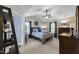 Main bedroom with vaulted ceiling, a ceiling fan, large windows, and carpet floors at 3204 Terrel Mill Rd, Raleigh, NC 27616
