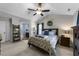 Bright main bedroom with a vaulted ceiling, ceiling fan, decorative wreath, and en suite bathroom at 3204 Terrel Mill Rd, Raleigh, NC 27616