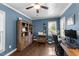 Home office with hardwood floors, a ceiling fan, natural light, and built-in bookcase at 3204 Terrel Mill Rd, Raleigh, NC 27616