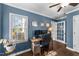 Home office featuring natural light, dual monitors, and a comfortable leather chair at 3204 Terrel Mill Rd, Raleigh, NC 27616