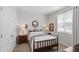 Comfortable bedroom with natural light, wooden furniture, and a cozy, inviting atmosphere at 321 Everly Mist Way, Wake Forest, NC 27587