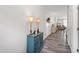 Hallway with a console table, lamps, and a view into the living room creating a cozy atmosphere at 321 Everly Mist Way, Wake Forest, NC 27587