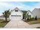 Charming home with manicured landscaping, a two-car garage, and a welcoming entrance at 321 Everly Mist Way, Wake Forest, NC 27587