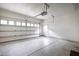 Clean garage with windows and an automatic door, providing secure parking and storage space at 321 Everly Mist Way, Wake Forest, NC 27587