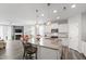 Spacious kitchen with a large island, granite countertops, and modern stainless steel appliances at 321 Everly Mist Way, Wake Forest, NC 27587