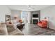 The living room offers a ceiling fan, a cozy fireplace, and ample natural light streaming through the sliding glass doors at 321 Everly Mist Way, Wake Forest, NC 27587