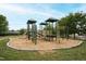 Playground with climbing structures, swings, and soft ground cover, surrounded by green space at 321 Everly Mist Way, Wake Forest, NC 27587