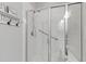 Modern bathroom features a glass shower with white subway tile and convenient grab bars at 321 Everly Mist Way, Wake Forest, NC 27587