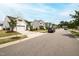 Charming street view featuring well-maintained homes, sidewalks, and manicured lawns at 321 Everly Mist Way, Wake Forest, NC 27587