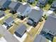 The aerial view showcases the backyard, detached garage and the neighboring homes, creating a sense of community at 3224 Wishing Well Wynd, Apex, NC 27502