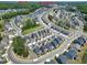 An elevated view displays a Primary-planned community with mature trees, walking trails, and a central location at 3224 Wishing Well Wynd, Apex, NC 27502