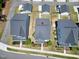 A birds-eye view displays the layout of homes in a peaceful neighborhood setting with well manicured lawns at 3224 Wishing Well Wynd, Apex, NC 27502