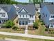 Aerial view of a gray home with well-maintained landscaping in a neighborhood at 3224 Wishing Well Wynd, Apex, NC 27502
