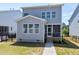 View of backyard featuring black metal fence, green grass and gray vinyl siding at 3224 Wishing Well Wynd, Apex, NC 27502