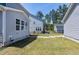 A spacious backyard provides a secure space for recreation, bordered by neighboring homes and mature trees at 3224 Wishing Well Wynd, Apex, NC 27502