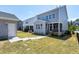 View of a spacious backyard featuring green grass, metal fencing, and gray vinyl siding at 3224 Wishing Well Wynd, Apex, NC 27502