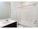 Bathroom with vanity, toilet and a shower-tub combo with white tiles at 3224 Wishing Well Wynd, Apex, NC 27502