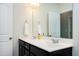 Bathroom vanity featuring double sinks, framed mirror, and modern faucets at 3224 Wishing Well Wynd, Apex, NC 27502